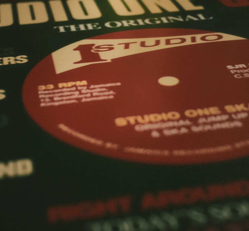 Extreme close-up of a dark red Studio One vinyl record label with white text visible.