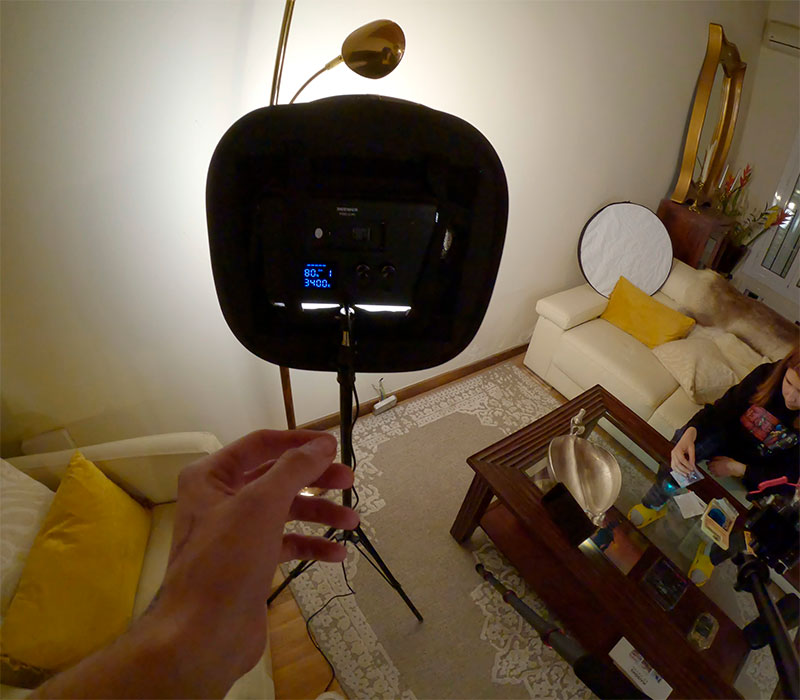 Behind the scenes photo showing a large softbox lighting setup inside a living room for the Burnout short film production