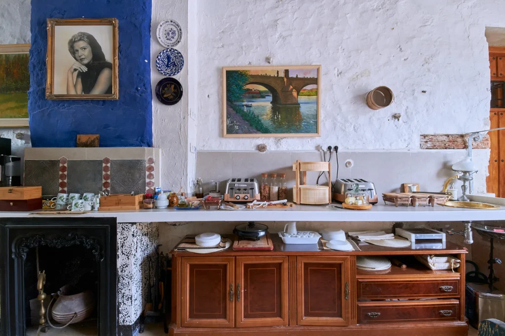 Interior detail shot of a rustic element (stone or wood) in a luxury hotel, showcasing texture, material, and attention to detail in editorial content.