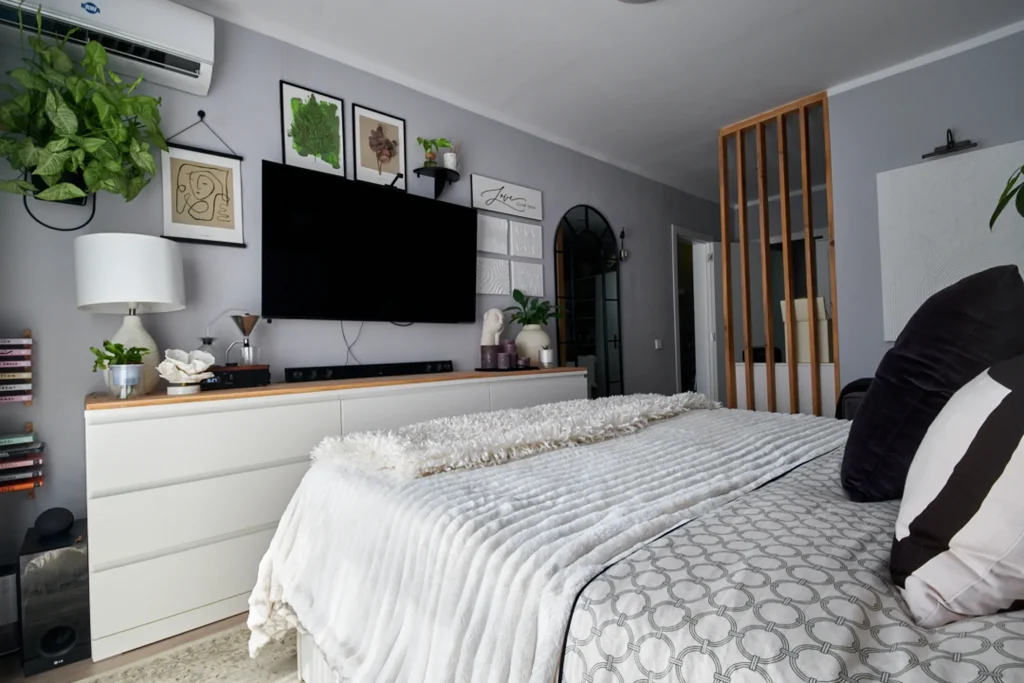 Full-room interior design photography with large-scale abstract artwork, emphasizing space, light, and modern minimalist architecture