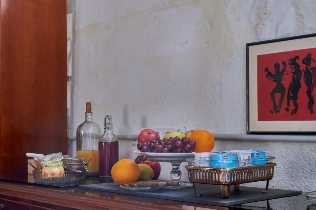 Detailed interior shot of a luxury suite at Castell Granadella, emphasizing the high-quality materials and warm, editorial lighting.